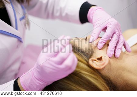 Doctor Injecting Pdo Suture Treatment Threads Into The Face Of A Woman.
