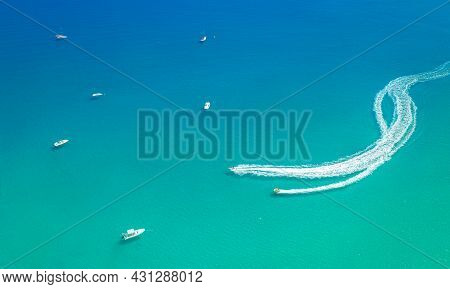 Water Sports At Seaside. Speed Boat With Slider Leaving White Trail. Minimalistic Seascape From Abov