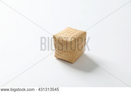Steamed Sticky Rice Is In Bamboo Container On White Background.