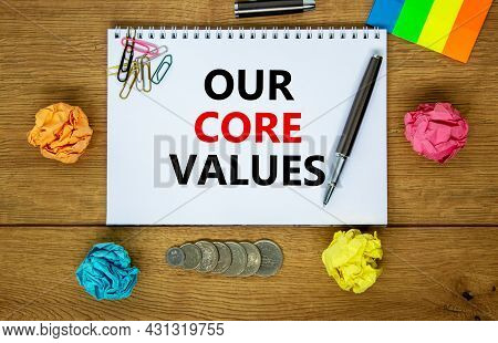 Our Core Values Symbol. Words 'our Core Values' On White Note. Wooden Table, Colored Paper, Paper Cl