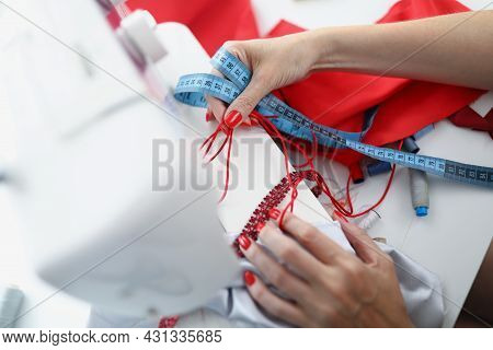 The Seamstress Holds Samples For Sewing Product