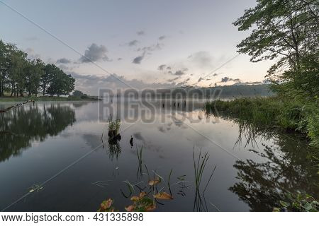 Foggy Flatland Riverside At Summer Sunrise Time