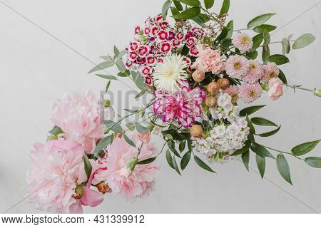 Bouquet of pink flowers on white background