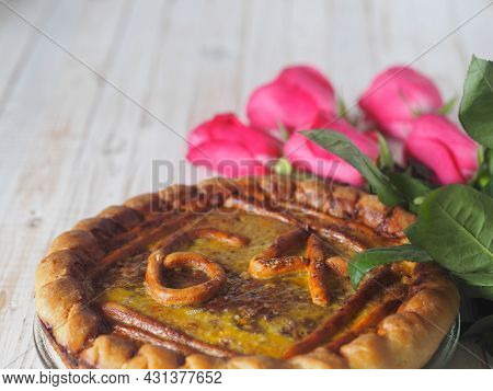 View In Front. Round Open Home Celebratory Apple, Doused With Beaten Eggs, Cake With Numbers 64 And 