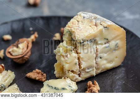 French Blue Cheese Roquefort, Made From Sheep Milk With Walnuts. Food Recipe Background. Close Up.