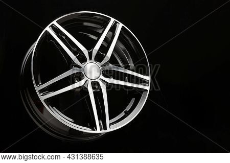 New Black Alloy Wheel Sports Car In The Shape Of A Five-pointed Star. Copy Space