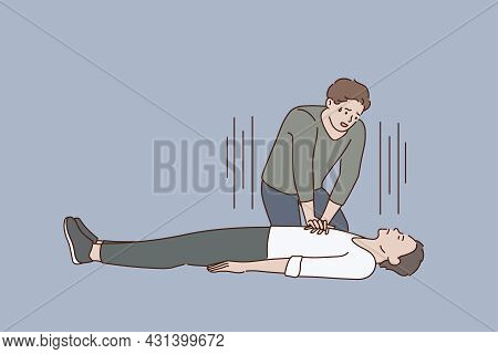 First Aid And Heart Massage Concept. Young Stressed Man Sitting On Knees Making Heart Massage To Lyi