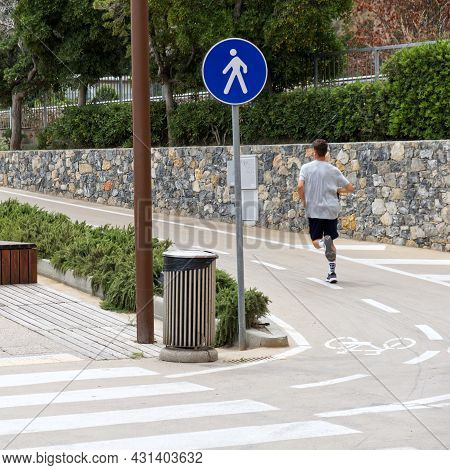 Loano, Italy - 12 July 2021: Sign Of A Pedestrian Street Next To A Bike Path On The Waterfront Of A 
