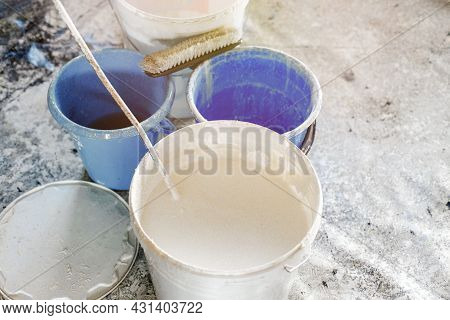 The Concept Of Repair Of The House And Premises. Buckets Of Paint And Lime For Whitewashing And Pain