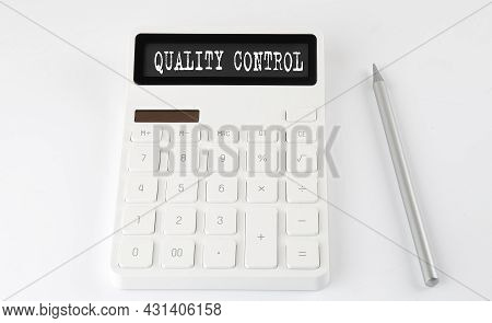 Quality Control Business Text On Calculator With Pencil
