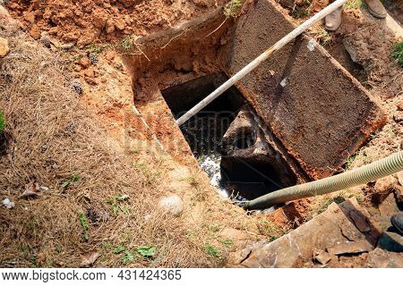 Opened Septic Tank Showing A High Level Of Sludge, Ready To Pump, Horizontal Aspect
