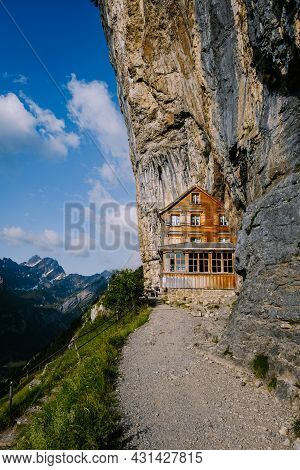 Swiss Alps And A Mountain Restaurant Under The Aescher Cliff Viewed From Mountain Ebenalp In The App