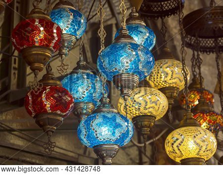 Middle Eastern Lambas Of Different Colors And Sizes Are Hanging In The Bazaar. Bright Traditional Ar