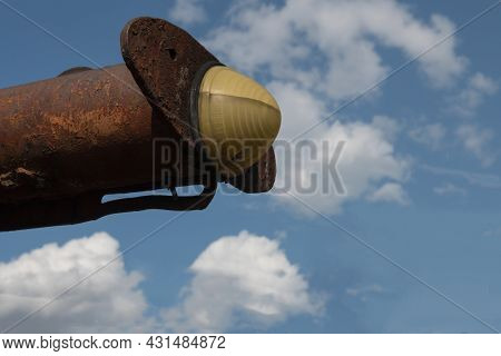 Close-up Of The Boundary Light Of An Old Rusty Scraper Wagon With Blue Sky Background And Clouds