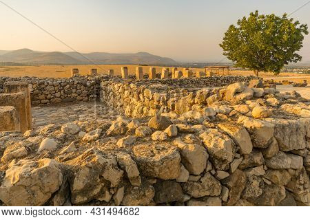 Sunset View Of Ancient Israelite Buildings Remains, With Trees And Landscape, In Tel Hazor National 