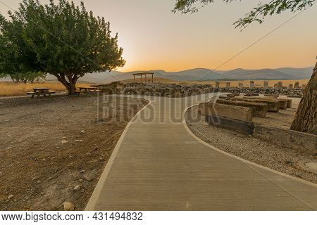 Sunset View Of Ancient Israelite Buildings Remains, With Trees And Landscape, In Tel Hazor National 