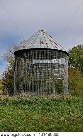 An Open Air Metal Caged Corn Bin Stands Empty.