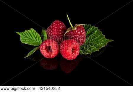 Raspberry Isolated. Raspberries With Leaf Isolate. Raspberry With Leaf Isolated On Black Background