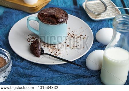 Mugcake Is Microwaved. Homemade Cupcake In A Mug Is On A Plate.