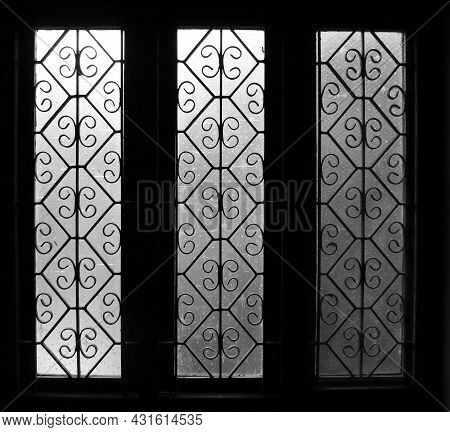 Light Gradient On Three Translucent Glasses Of Identical Windows With Vintage Designs Symmetric Patt