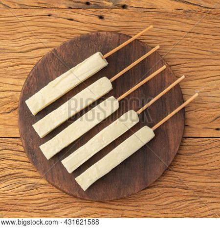 Rennet Or Coalho Cheese On A Wooden Board.
