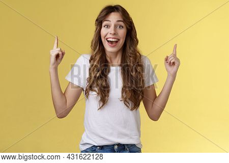Surprised Cheerful Celebrating Girl Lively Discuss Near Awesome Event Pointing Up Index Fingers Smil