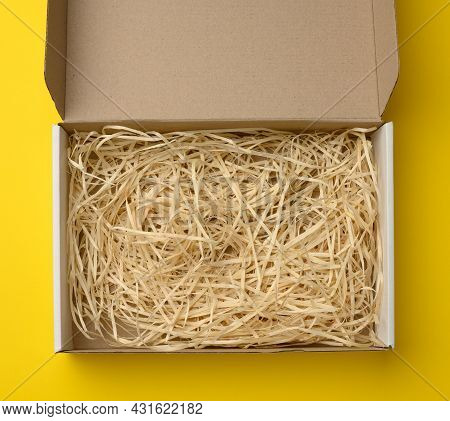 Empty Rectangular Open Corrugated Paper Box With Sawdust Inside. Packaging, Containers For Transport