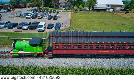 Ronks, Pennsylvania,june 2019 - Aerial View Of Percy The Tank Engine Approaching Thru Trees And Farm
