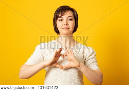 Be My Valnetine. Pretty Woman Confesses In Love, Shows Heart Gesture, Smiles Broadly, Has Romantic F