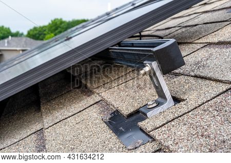 Rail, Bracket, And Anchor To A Solar Panel Installed On A Asphalt Shingle Roof