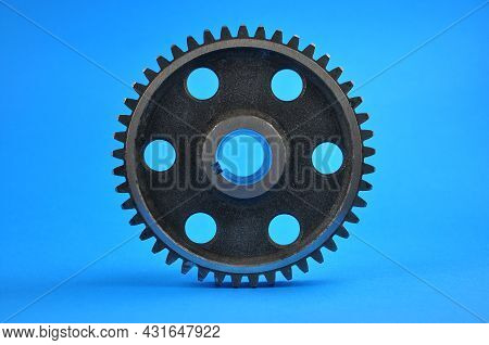 Gear Wheel On A Blue Background. Spare Parts,