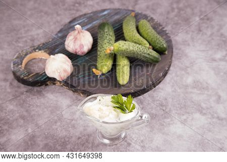 Top View Of The Traditional Greek Tzatziki Sauce Made Of Cucumbers, Yogurt And Garlic. Mediterranean