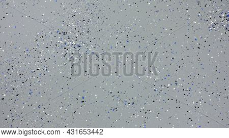 A Freshly Painted With A Gray Epoxy Finish Sprinkled With Blue, Black And White Plastic Chips.