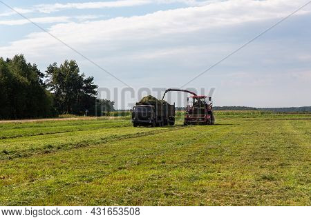Combine Harvesting A Green Field
