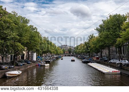 Amsterdam, Netherlands - August 13, 2021: Light Reflecting Keizersgracht Se From Leidsestraat Bridge