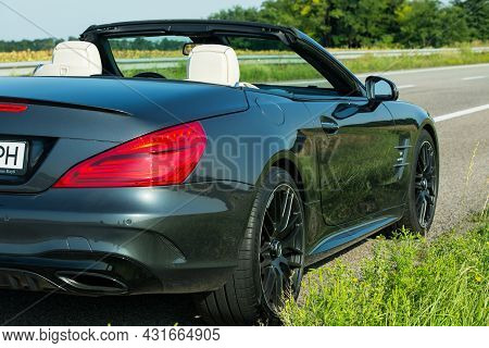Dnepropetrovsk, Ukraine - 08.24. 2021: Photos Of The Mercedes Benz Sl550 Convertible On The Road.