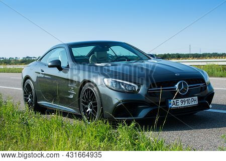 Dnepropetrovsk, Ukraine - 08.24. 2021: Photos Of The Mercedes Benz Sl550 Convertible On The Road.
