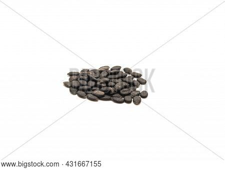 Heap Of Organic Angled Luffa Or Chinese Okra Seeds Isolated On White