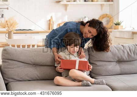 Birthday Of Child In Family: Happy Mother Giving Gift In Decorated Present Box To Excited Kid On Ann