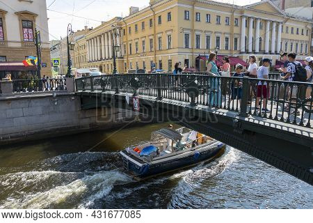 St. Petersburg, Russia - July 09, 2021: People In The Italian Bridge Through The Griboedov Canal In 