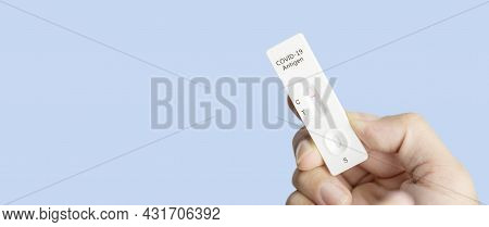 Own Hand Showing Covid-19 Negative Test Result With Sars Cov-2 Rapid Antigen Test Kit (atk) And Blue
