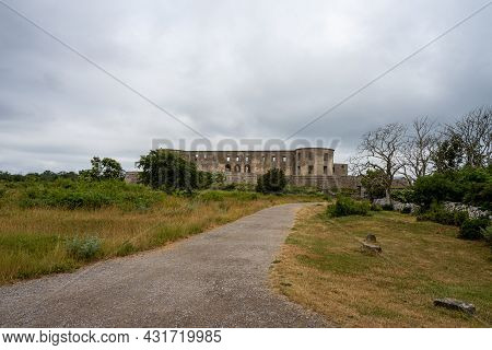 An Old Castle With A Dramatic Sky In The Background. Borgholm Castle Ruins On The Baltic Sea Island 