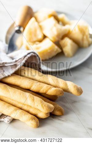 Grissini sticks. Traditional italian bread sticks on white table.