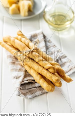 Grissini sticks. Traditional italian bread sticks on white table.