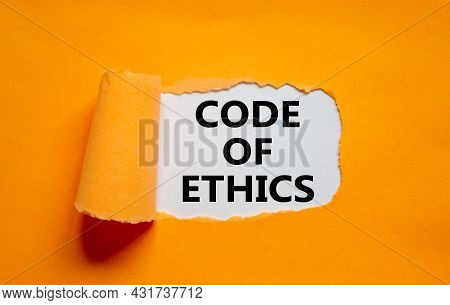 Code Of Ethics Symbol. Words 'code Of Ethics' Appearing Behind Torn Orange Paper. Beautiful Orange B