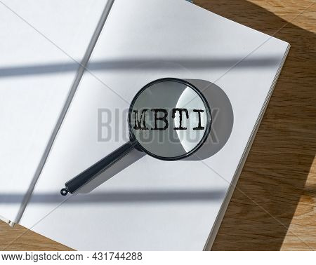 Mbti Test Of Personality Types. Psychology Concept. Book And Magnifier.