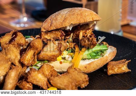 Italian Ciabata Bread Served With Fresh Salade And Vegan Fried Chicken In Pieces