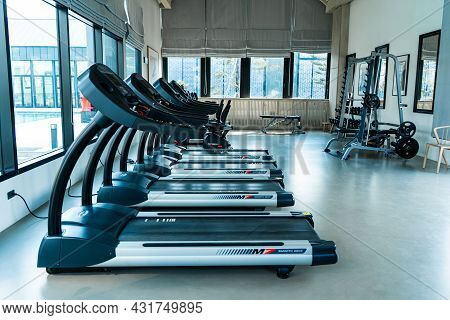 Modern Gym Interior. Treadmills In Row. Samui , Tailand - 02.08.2020