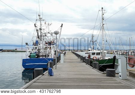 Fishing Boats At The Wooden Dock In The Port Of Sassnitz On The Island Of Rugen In The Baltic Sea Ag