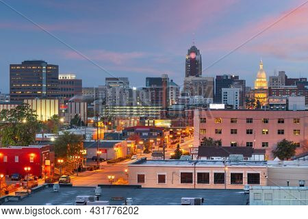 Lansing, Michigan, USA downtown city skyline at twilight.